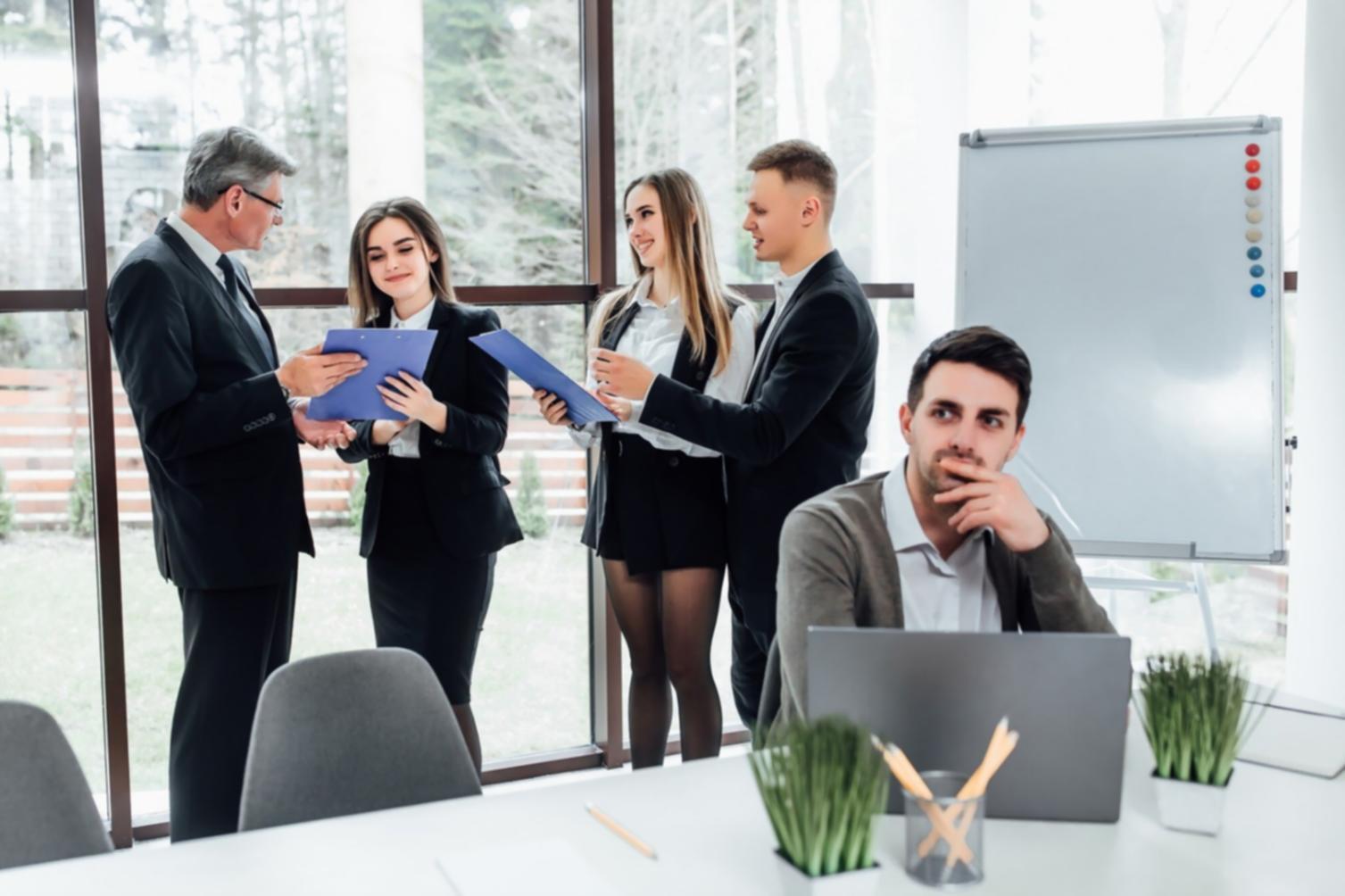 Modern office workspace with organized financial planning materials